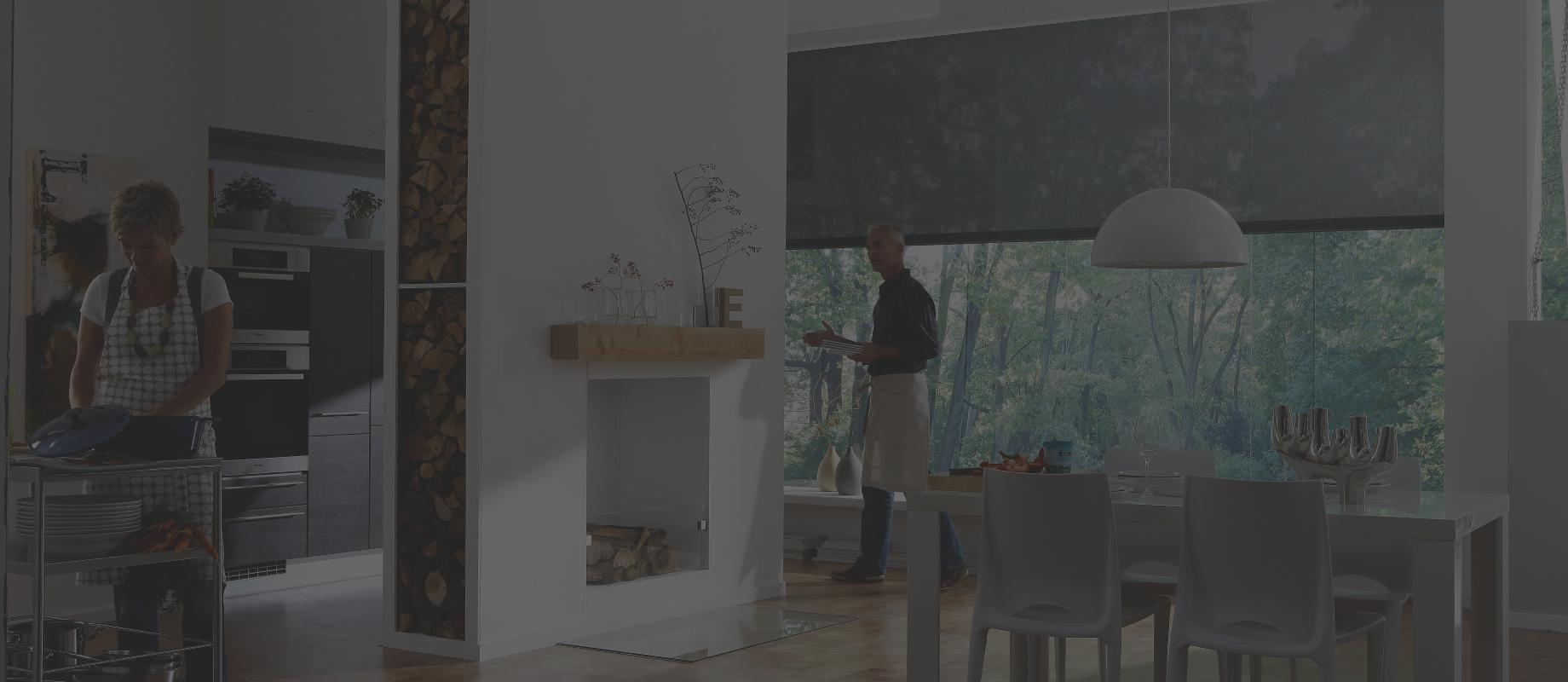 Dining Area with open kitchen and a cooking woman and a man