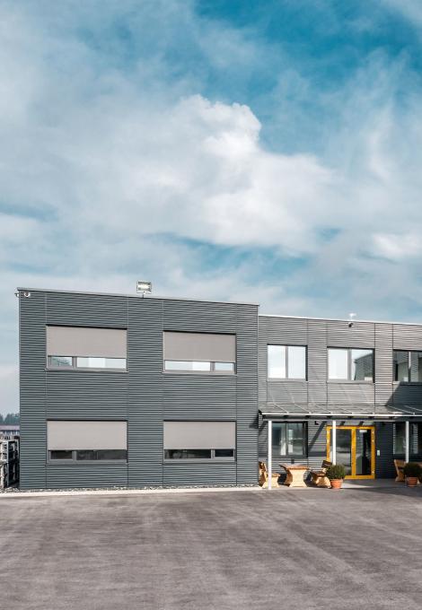 Modern commercial building with textile screens by daylight