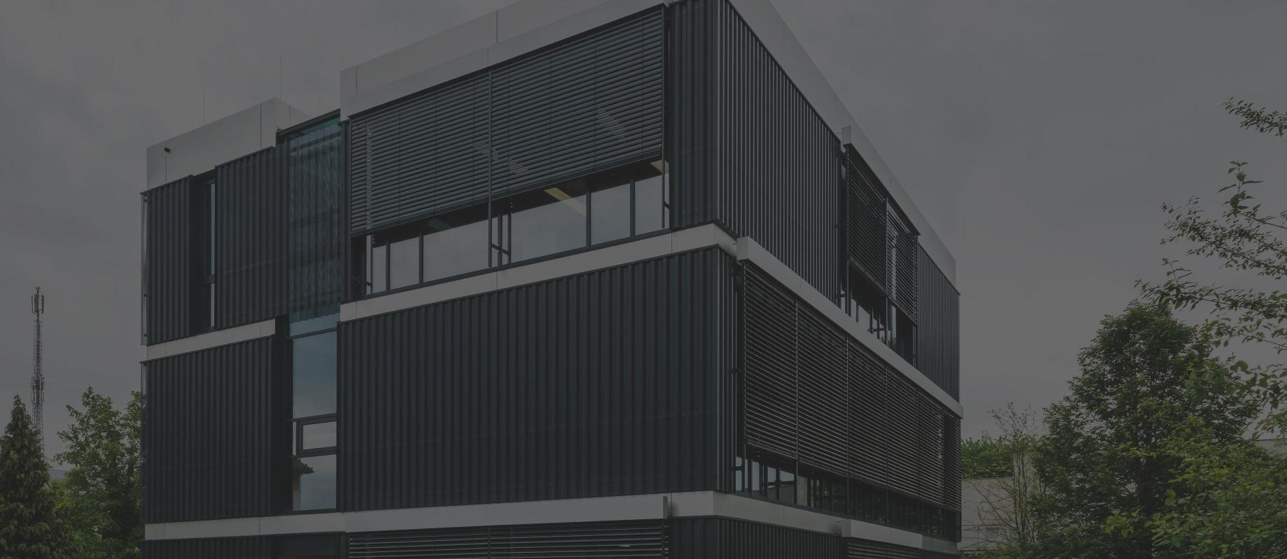 Modern office building with façade venetian blinds by daylight