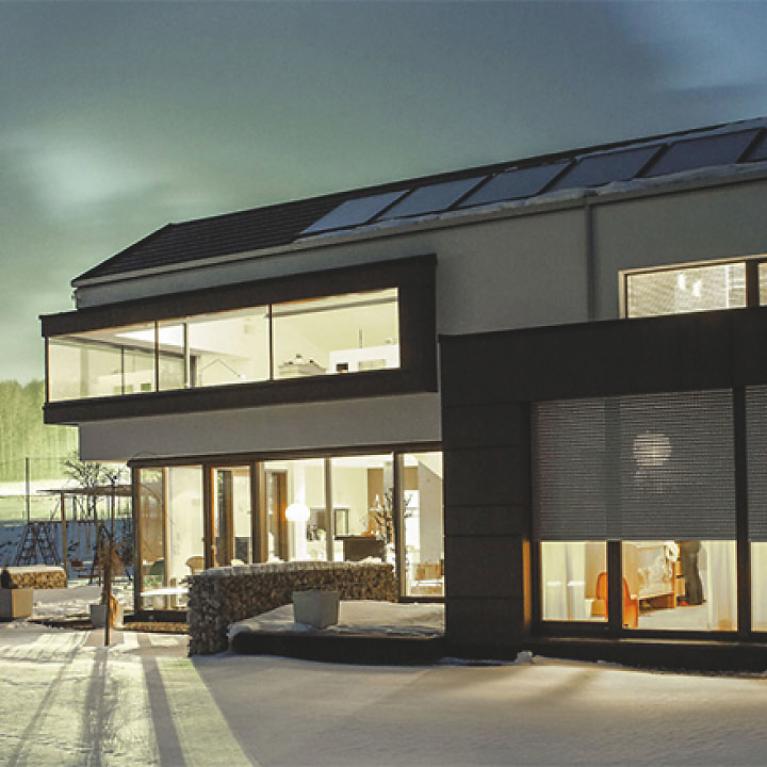 Residential building detail, at night with interior lighting