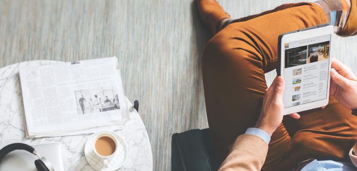 Man is sitting in an armchair with his tablet, ROMA press releases