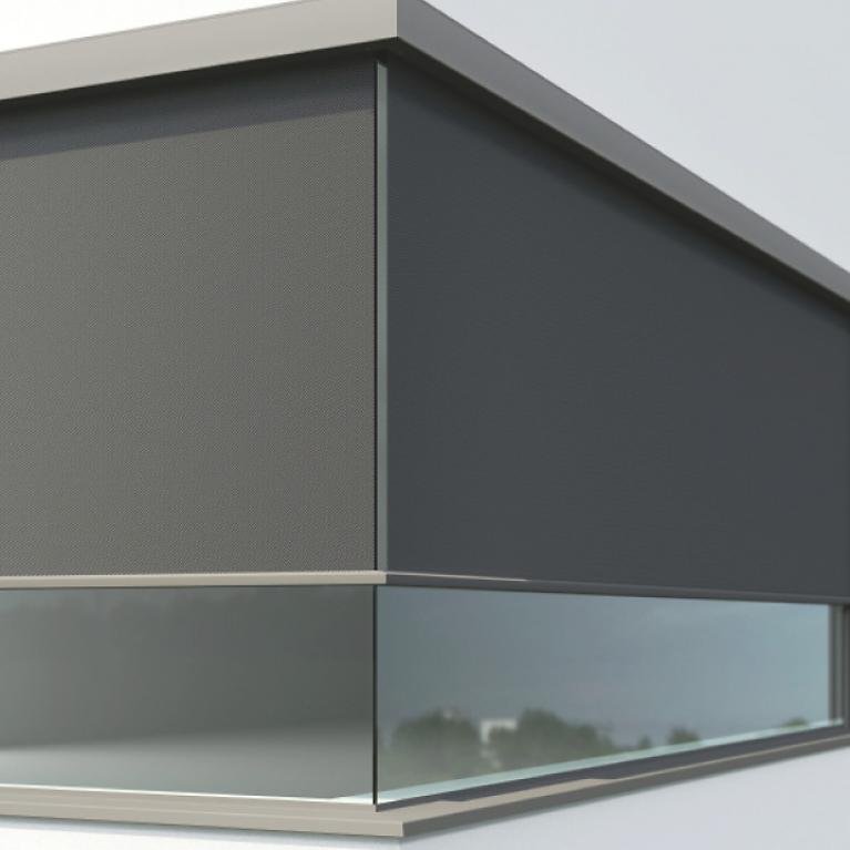 Close-up window front fully glazed corner with lowered textile screens