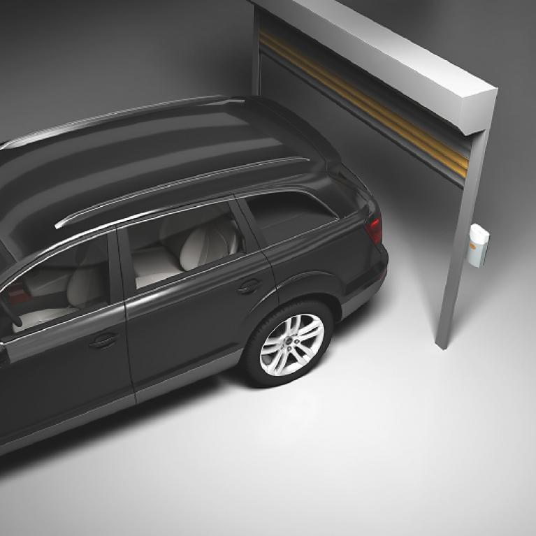 Roller door model side view with BMW Touring