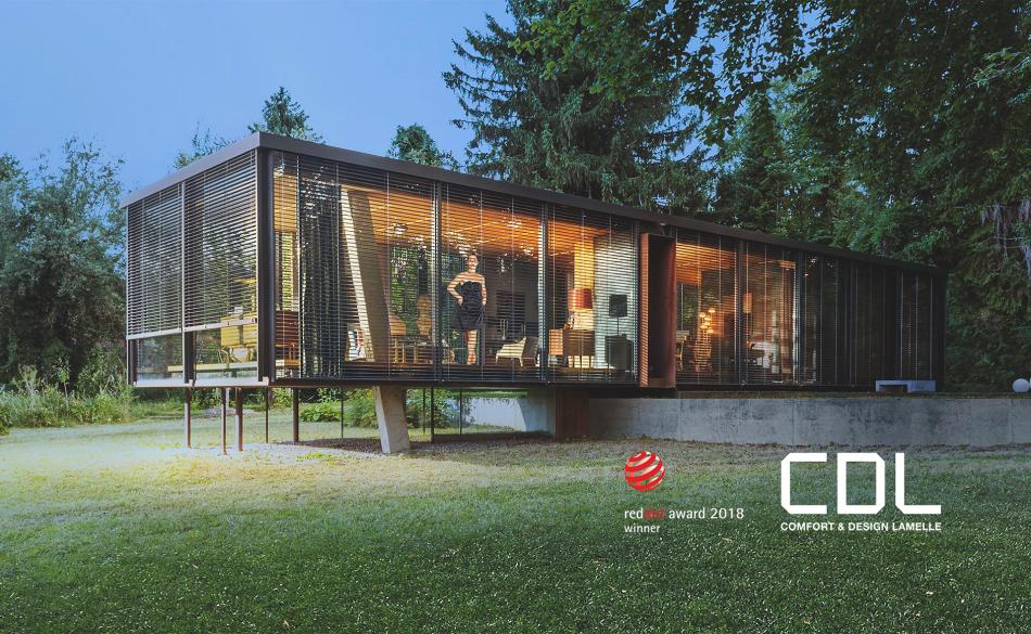 Modern window bungalow on stilts with external venetian blinds in the country by daylight