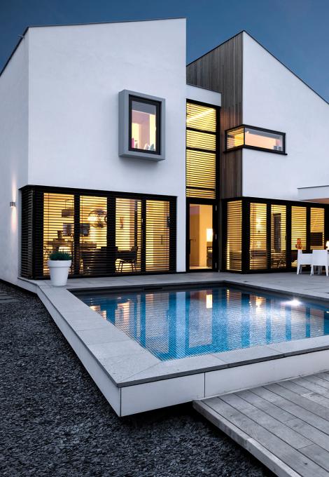 Modern house with interior lighting, modular external venetian blinds